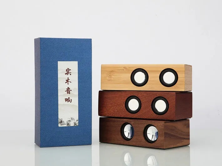 Wooden Bluetooth speaker in bamboo, black walnut, or sapele finish with 7-hour battery.