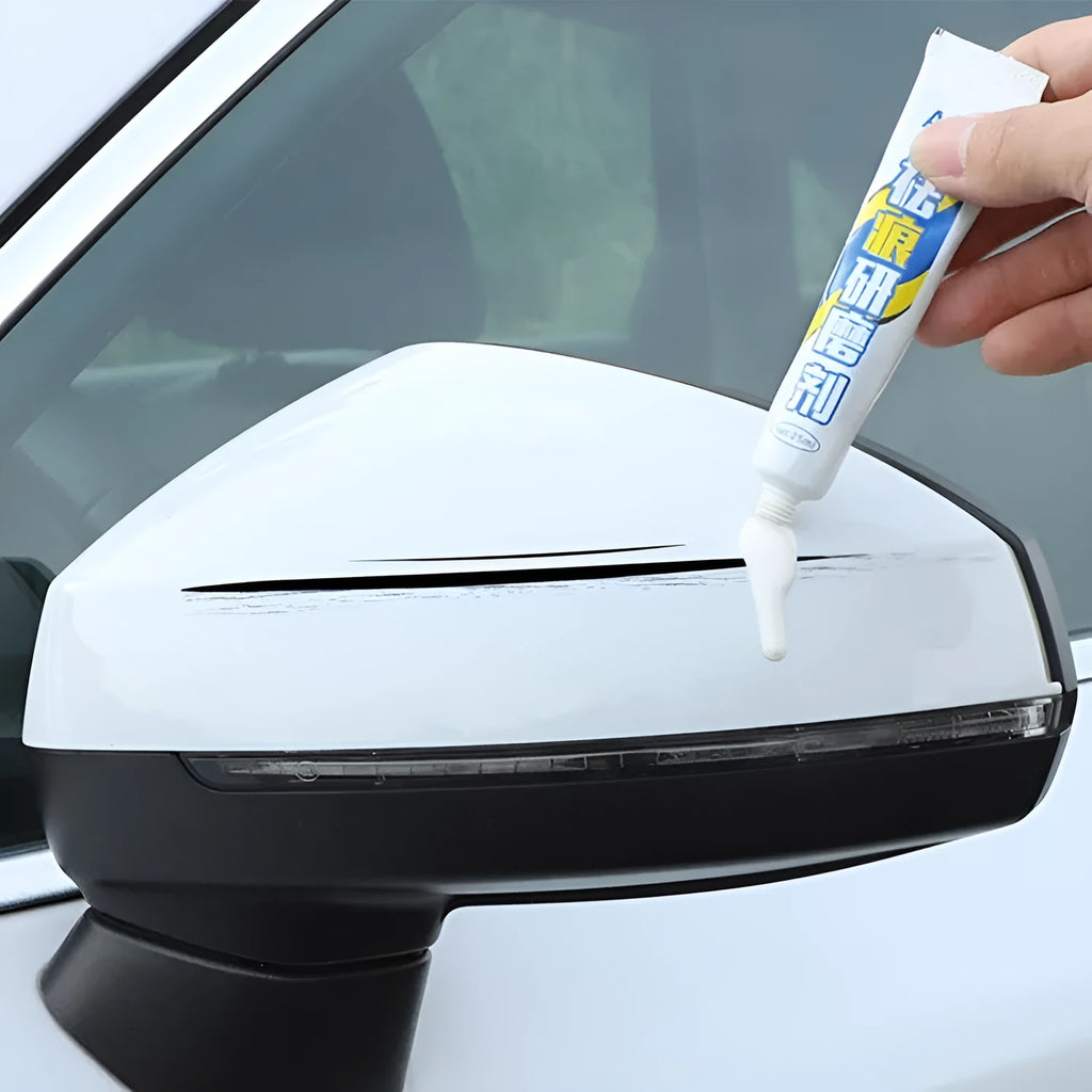 Automotive paint repair pen kit with touch-up paint, scratch wax, sponge, and sandpaper