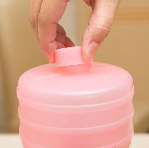 Water-filled fitness dumbbell for women in pink polypropylene plastic with leak-proof port