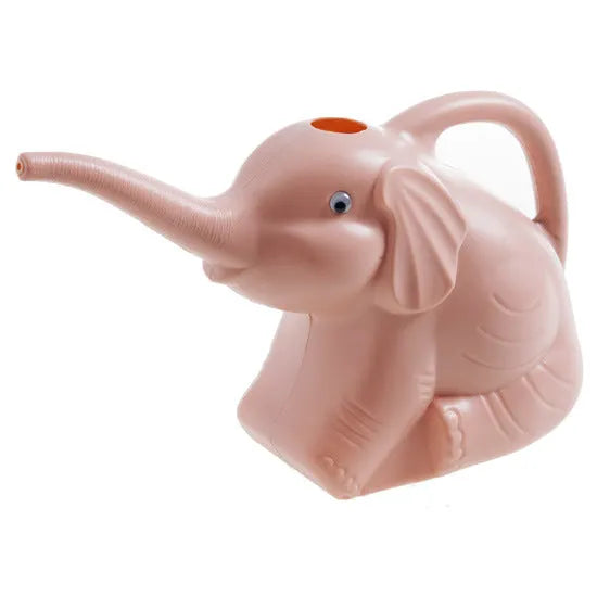 Blue elephant-shaped children's watering can with a long nozzle and baby bottle handle on a table.