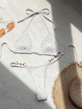 Blue leopard print women's bikini set on a mannequin, showing triangle top and briefs style.