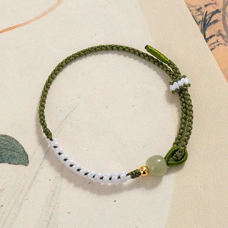 Chinese national bracelet with Hetian jade, sterling silver, and colourful cord carrying strap