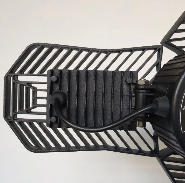 Foldable silver die-cast aluminium industrial LED lamp with a wide-angle lens for garage lighting.