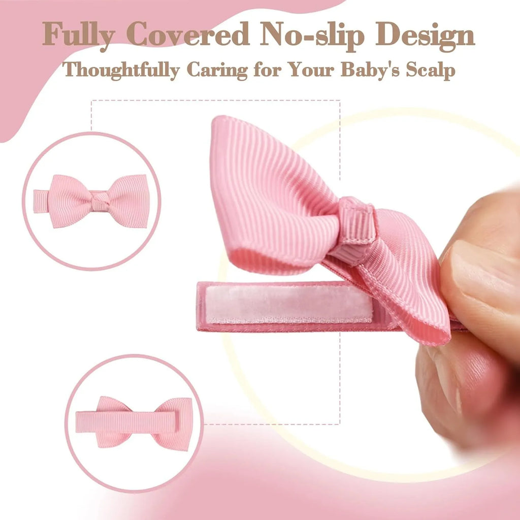 Assortment of pastel coloured baby hair clips and bows, including barrettes, laid out on a white background.