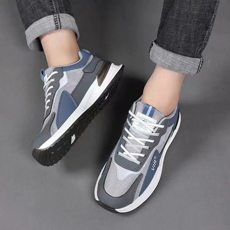 Men's colour block mesh sneakers in black, grey, and white with a lace-up design.