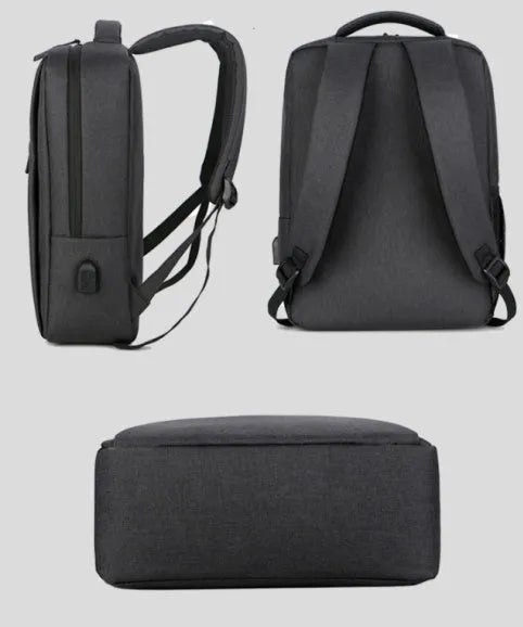 Waterproof Oxford cloth laptop backpack with rechargeable battery in black colour on a shoulder
