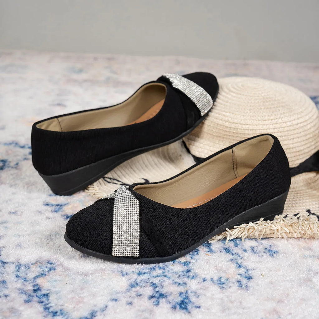 Black women's slip-on casual shoes with a chunky heel and rhinestone details on the fabric upper.