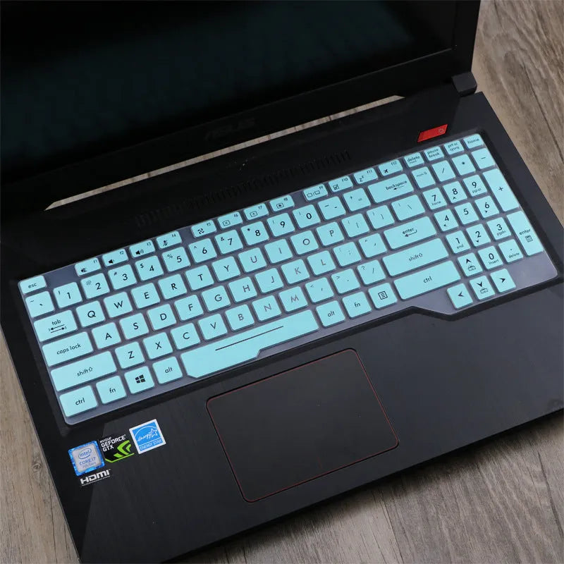 ASUS VivoBook 15 X513 laptop with a translucent mint coloured silicone keyboard protector fitted.