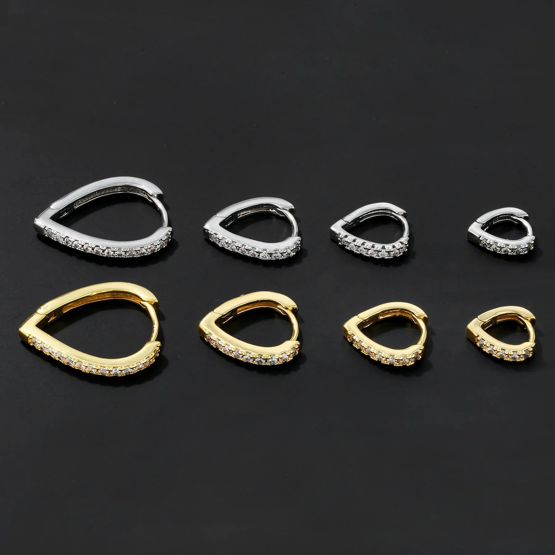 Geometric copper love ear clip with electroplated gold finish and heart design.