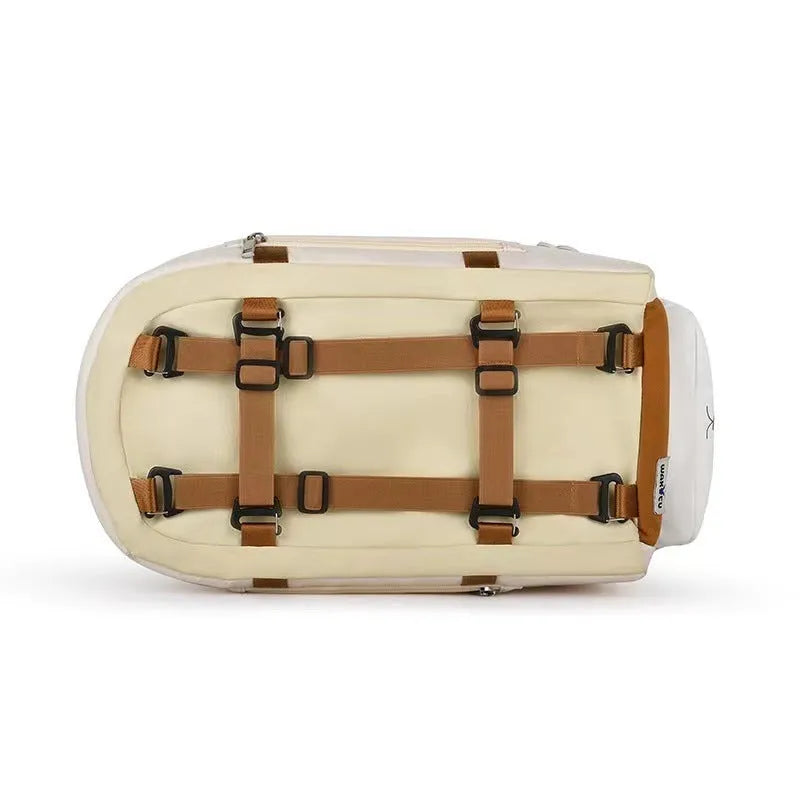 Hard-sided beige pet carrier with shoulder strap for cats and small dogs