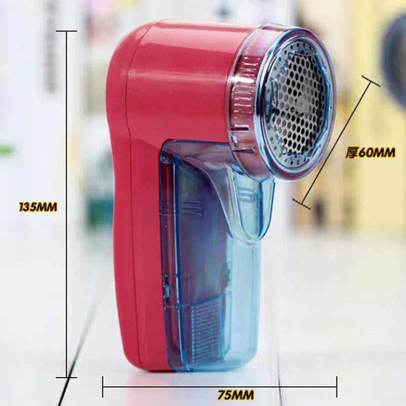 Portable electric lint remover handheld device on a blue background.