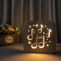 Square pine wood USB LED lamp with warm white light on a desk.