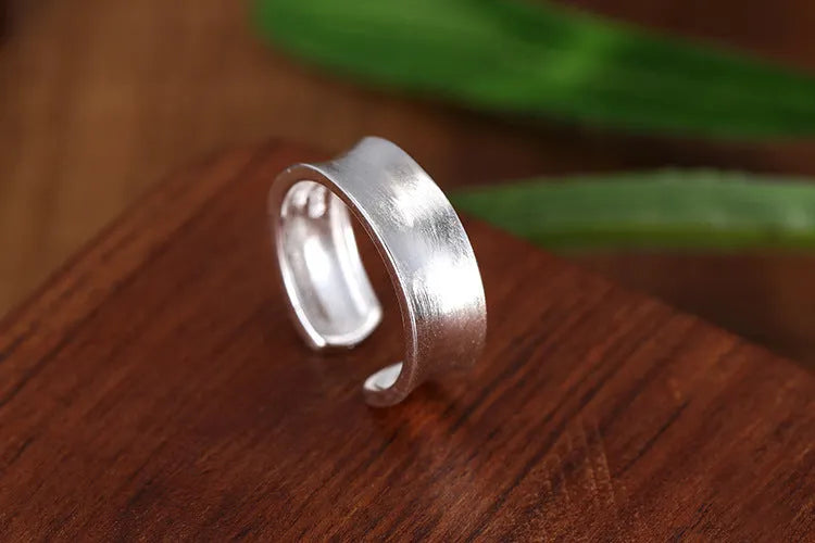 Geometric open ring in frosted sterling silver with adjustable opening