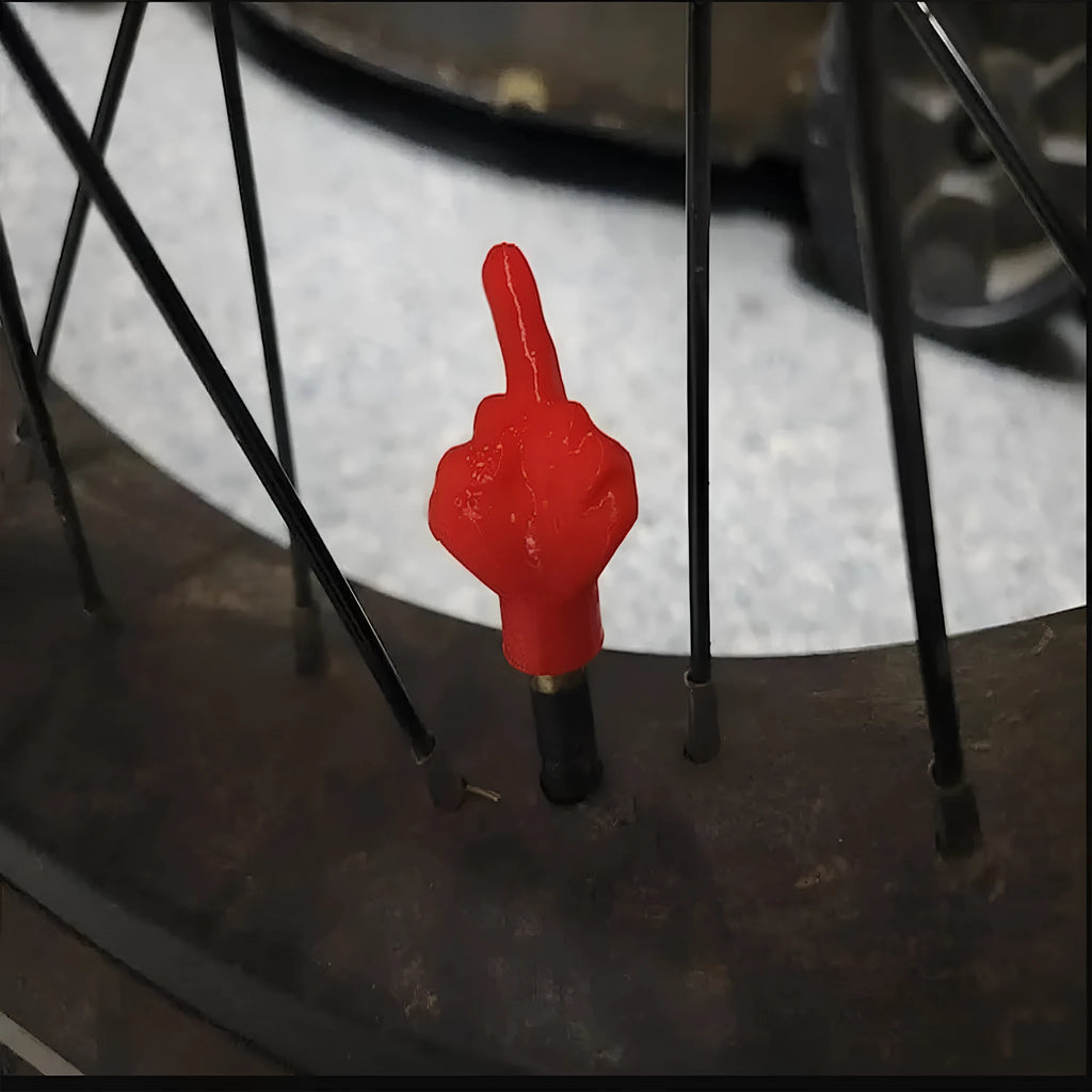 Eight latex tyre valve caps - four black and four skin colour - for car wheel valve protection