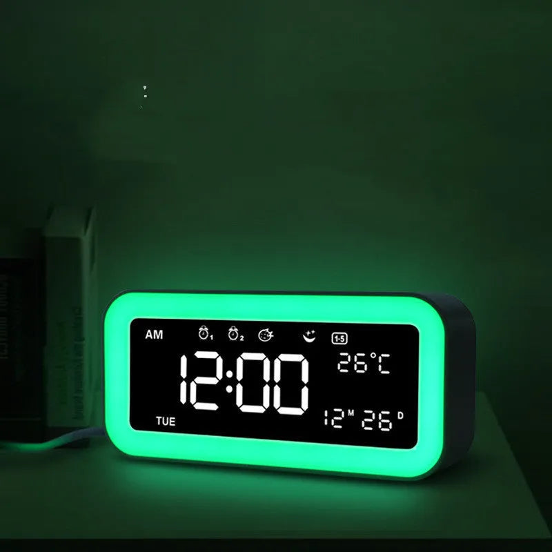 Blue rectangular LED atmosphere light alarm clock with digital display on bedside table