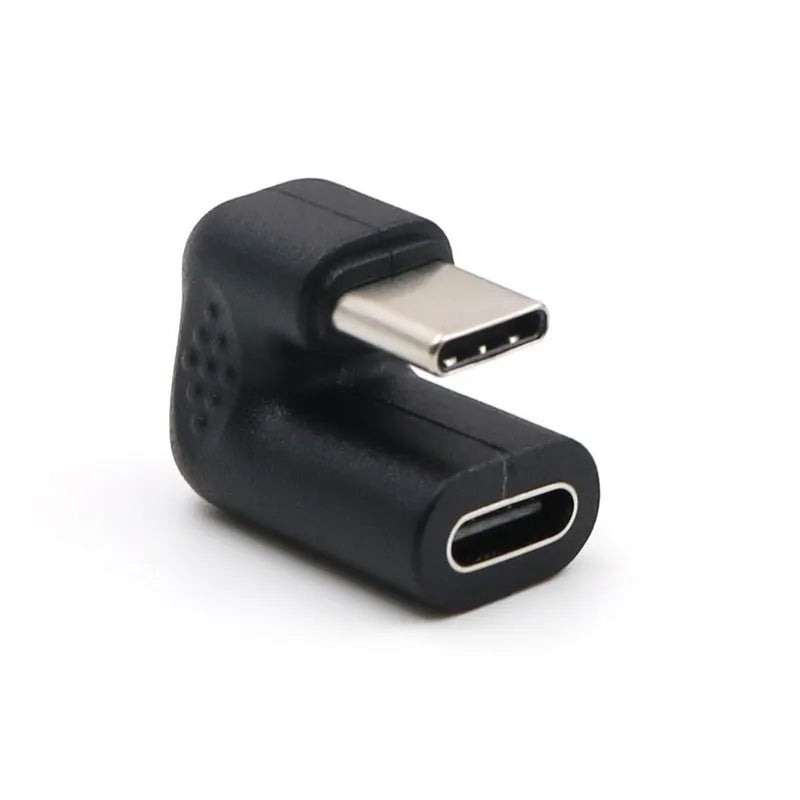 Four white USB-C Male to Female adapter cables with a U-bend shape on a grey background.