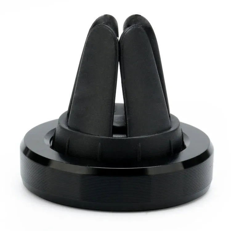 Magnetic car phone holder in rose gold attached to a car air vent