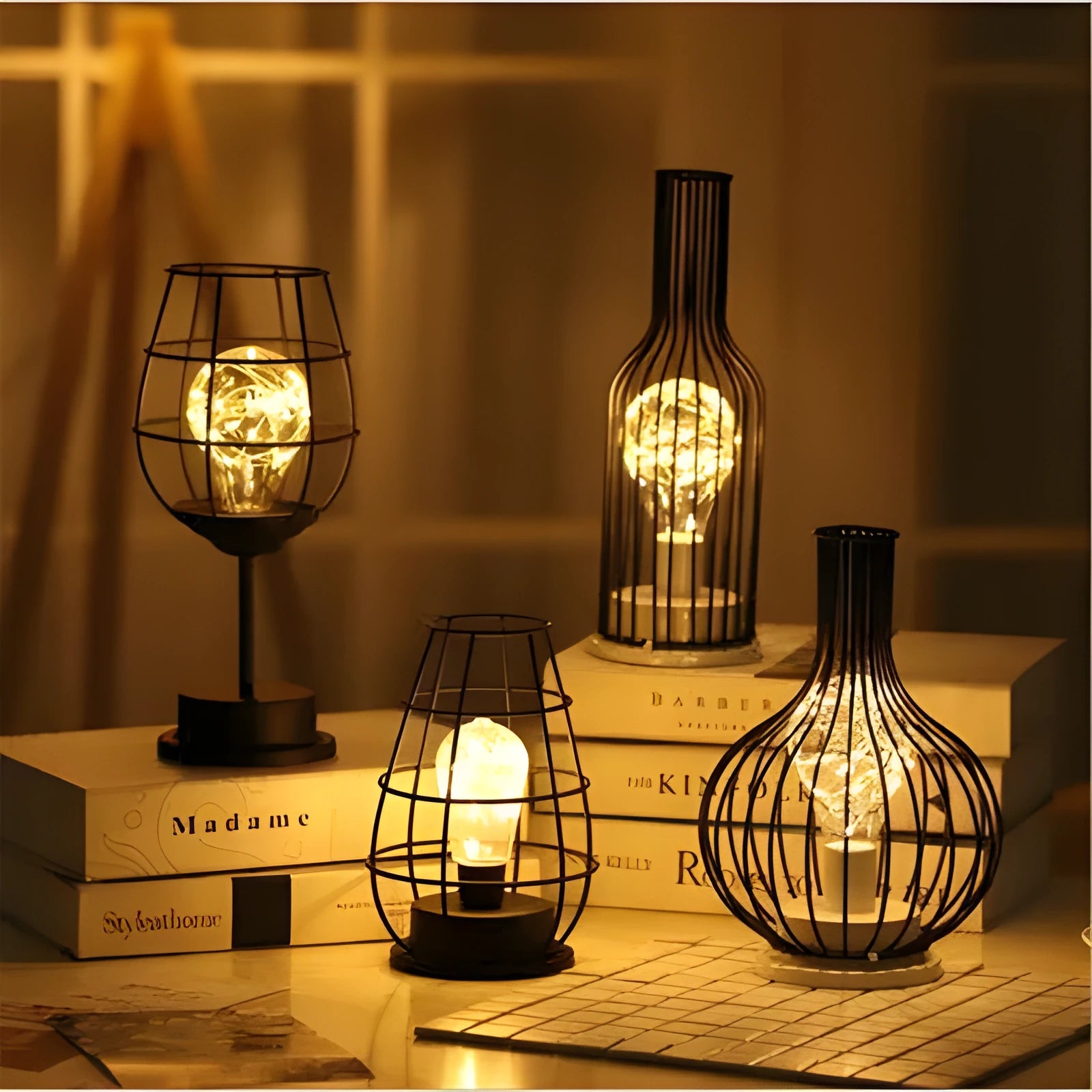 Minimalist hollow wrought iron table lamp in red wine glass style with warm white LED light.