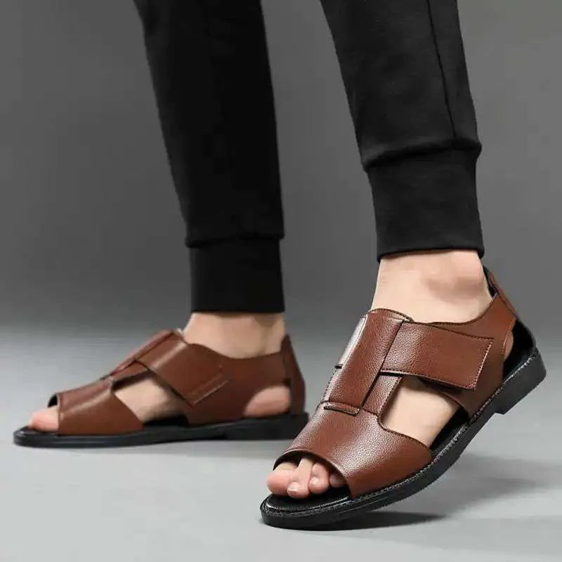 Men's black and brown leather casual sandals with open toe and rubber sole on a neutral background.