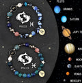 Set of two natural stone beaded bracelets featuring all twelve zodiac signs on elastic cord.