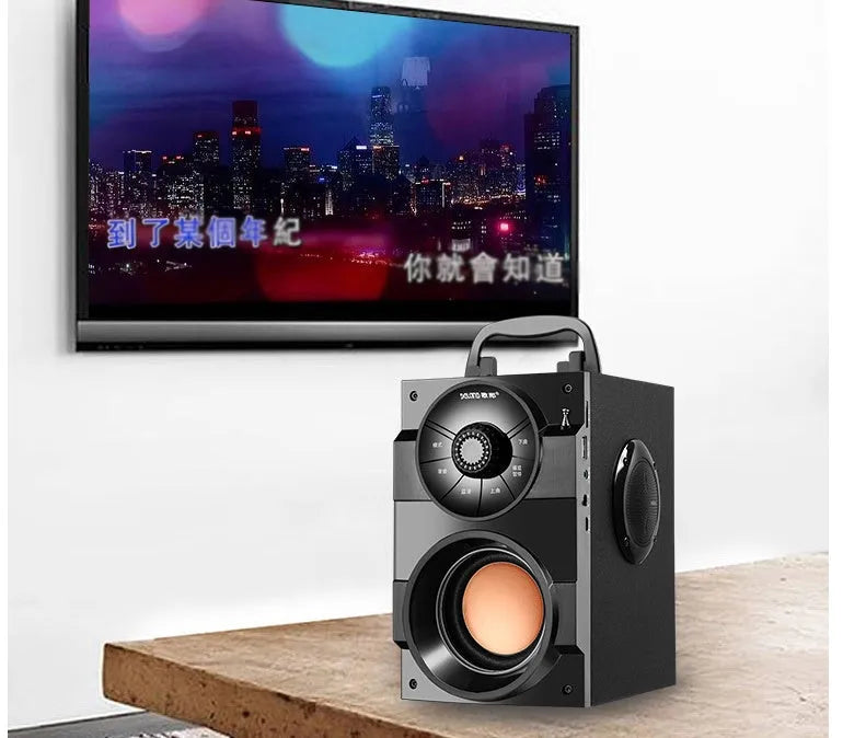 Black portable mini home audio system with subwoofer, satellite speakers, and USB charging cable