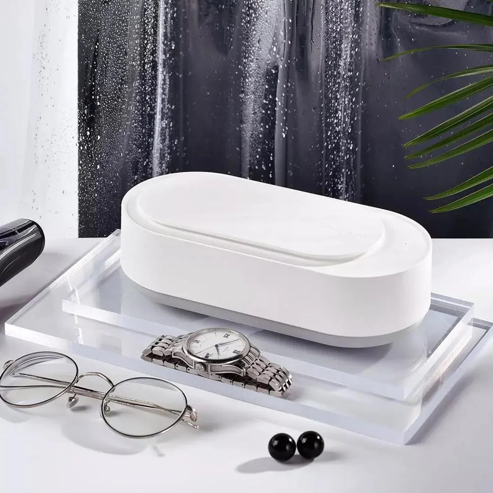 White portable ultrasonic cleaning machine with stainless steel tank for jewellery and glasses.