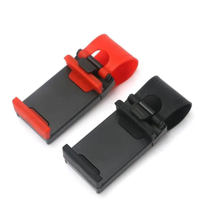 Black universal steering wheel phone holder clip mounted on a car steering wheel.