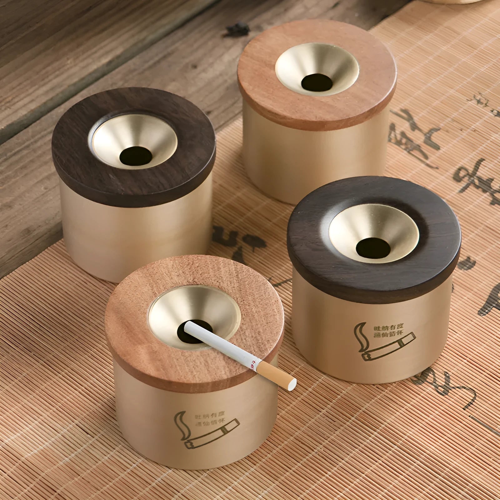 Brass-coloured copper ashtray with a wooden lid featuring a central hole, on a tabletop.