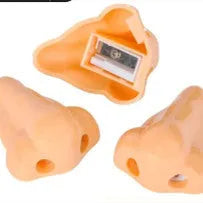 Flesh colour plastic student pencil sharpener with large nostril hole showing geometry shape