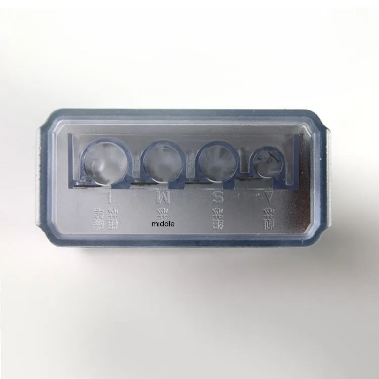 Four-hole geometric plastic pencil sharpener with included screwdriver on a white background.
