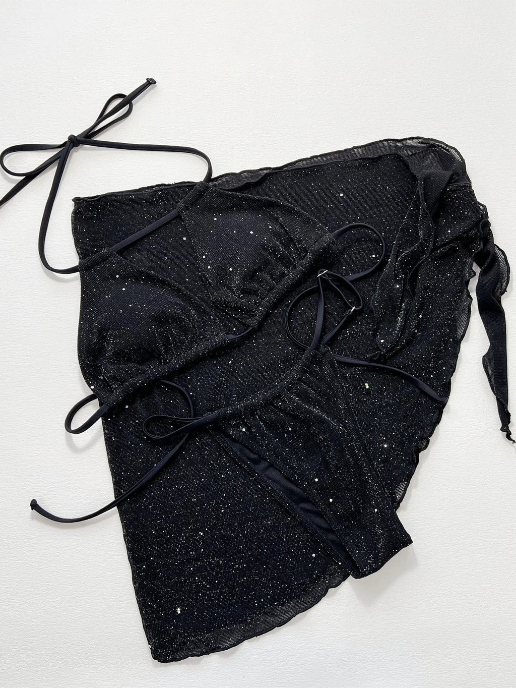 Black women's three-piece bikini swimsuit set consisting of a top and shorts on a mannequin.