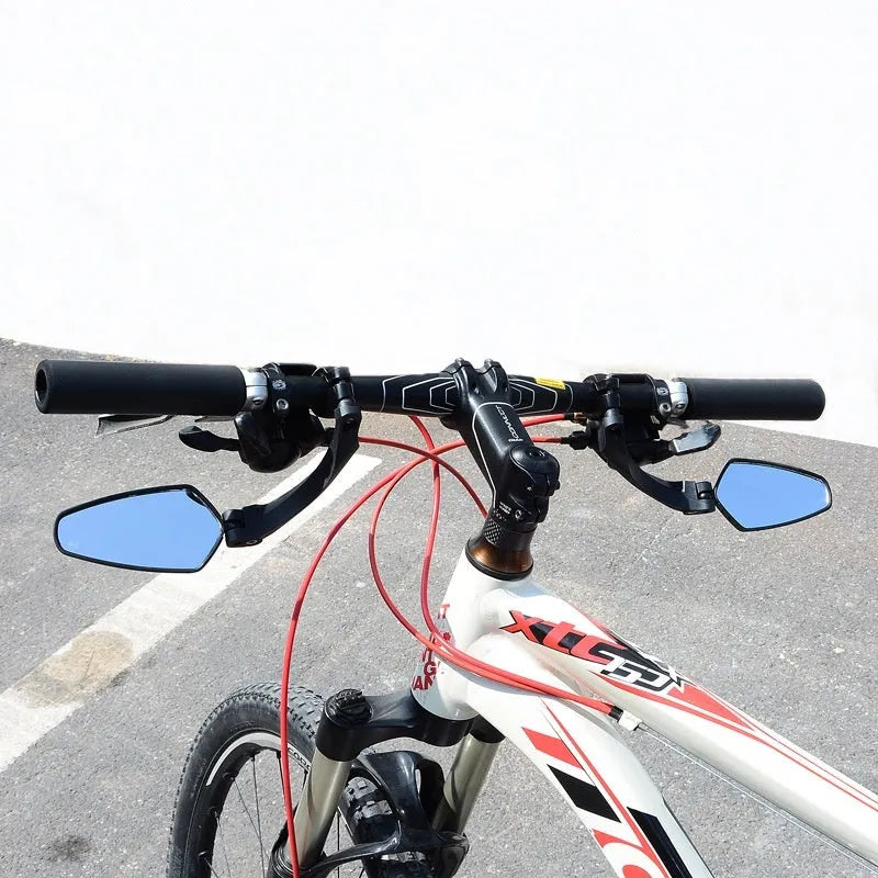 Black acrylic bicycle rearview mirror with rotatable adjustment mechanism mounted on handlebars