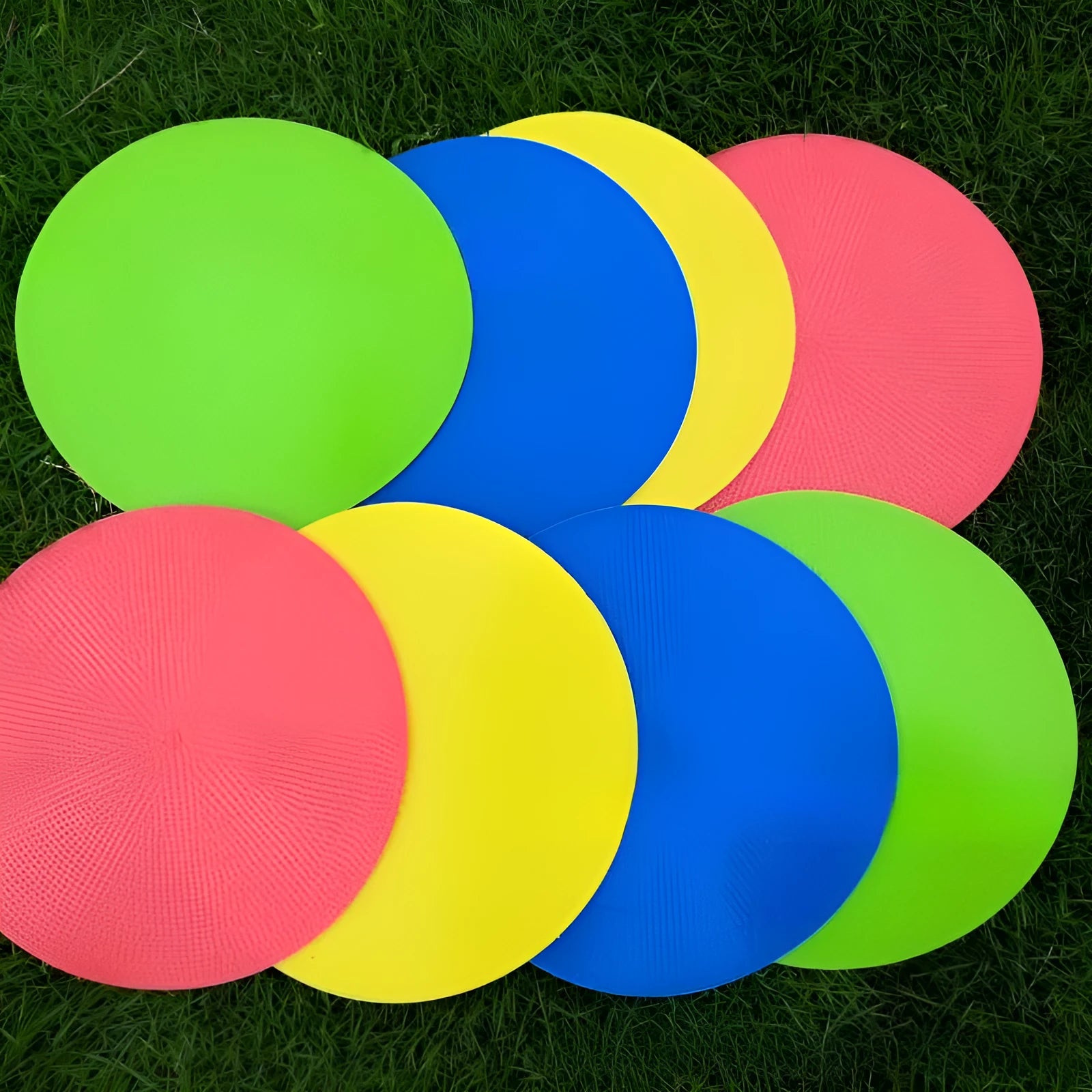 Soft yellow TPE football training disc on grass, showing 23cm diameter flat marker.