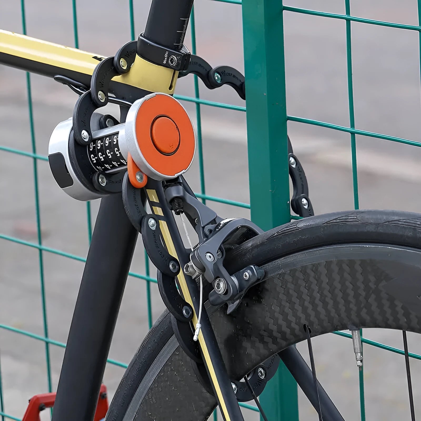 Portable black and black orange bicycle folding lock on a white background.