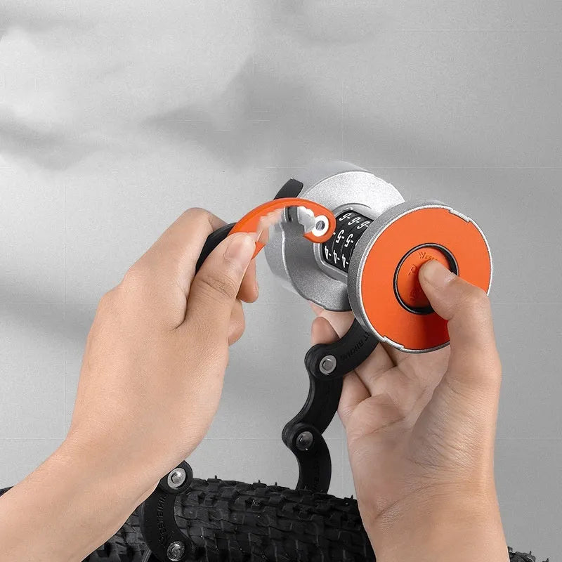 Portable black and black orange bicycle folding lock on a white background.