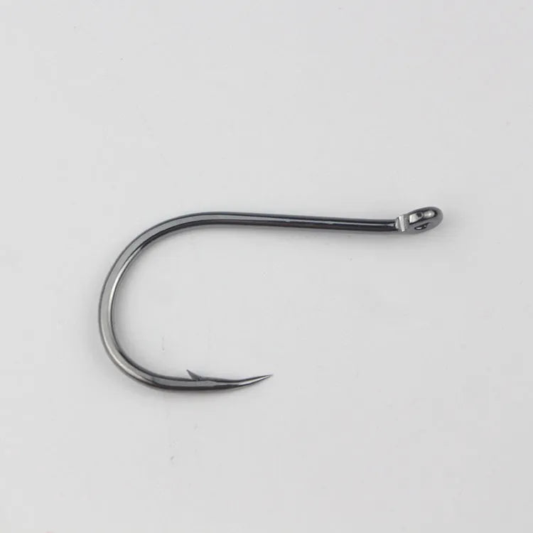 Barbed fishing hooks with hole ring in a bulk pack on a blue background.