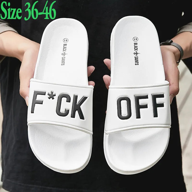 Men's black open-toe rubber slippers showing viscose sole construction