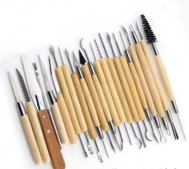27-piece pottery clay tool set with stainless steel, wood, and plastic tools in a brown roll package.