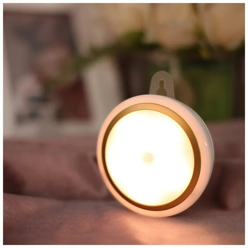 Compact circular white motion sensor LED light with a diameter of 80mm, suitable for wardrobe or corridor mounting.