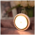 Compact circular white motion sensor LED light with a diameter of 80mm, suitable for wardrobe or corridor mounting.