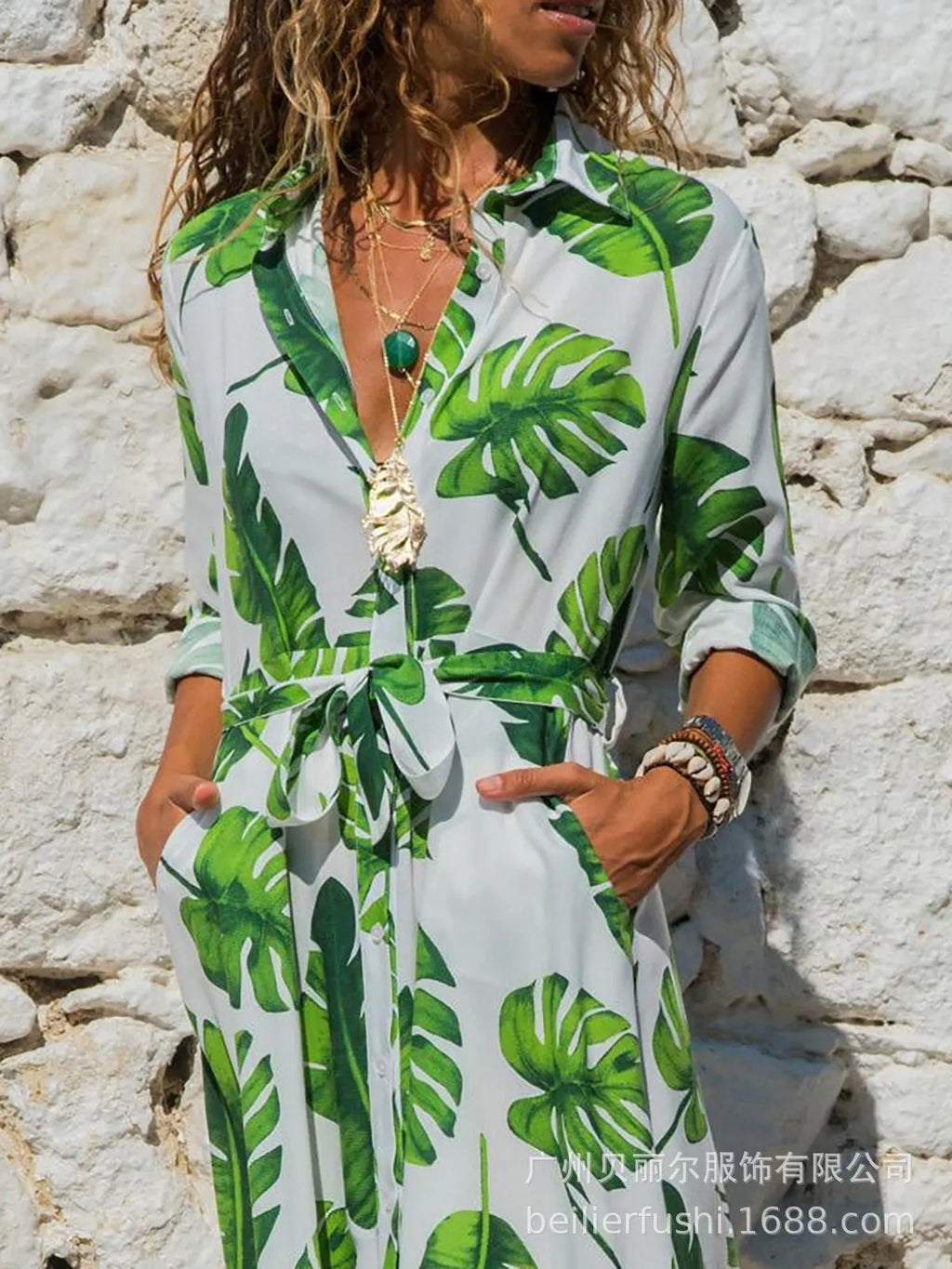 Women's printed chiffon maxi dress with V-neck and A-line skirt on a hanger.