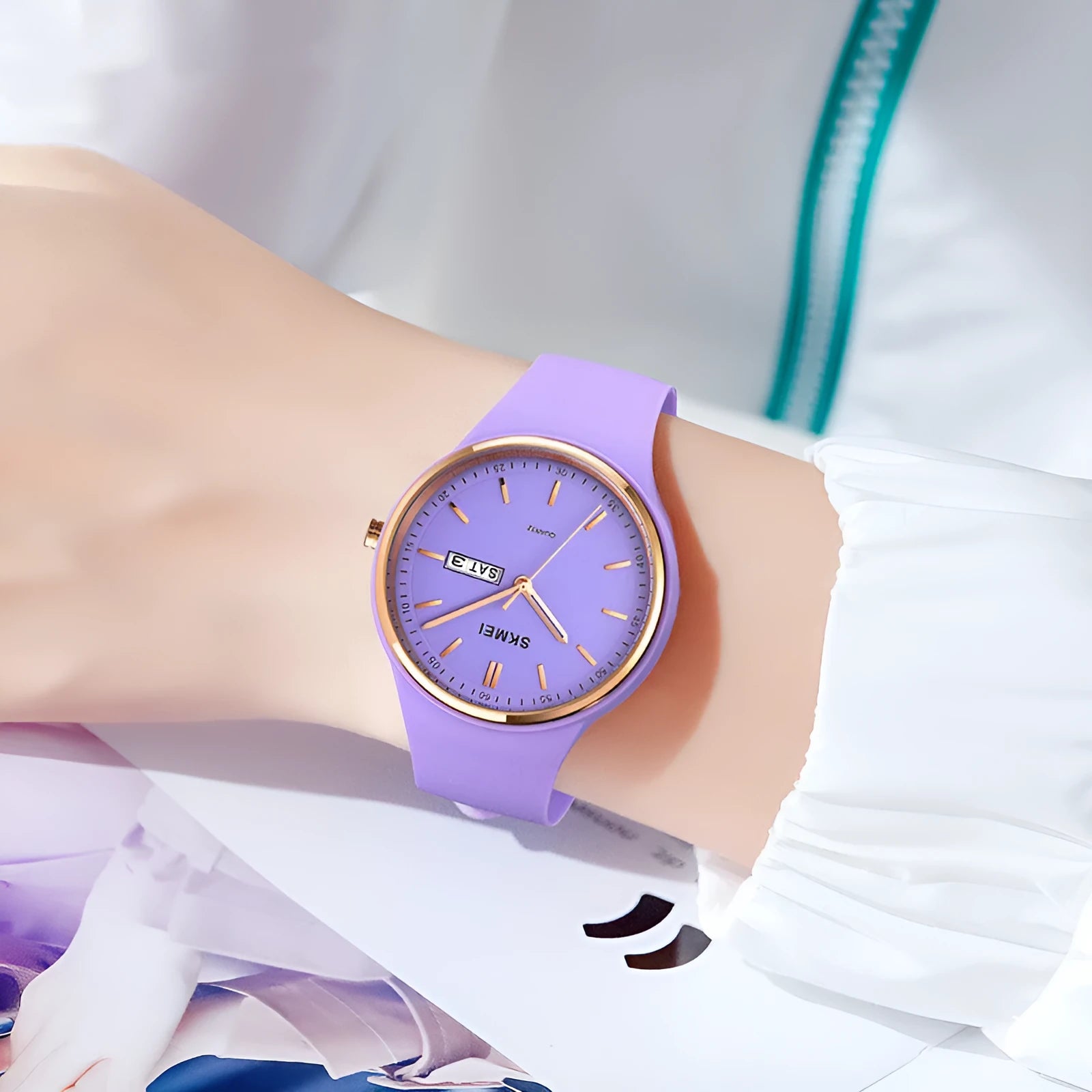 A women's quartz watch with a 42mm white dial on a light blue silicone strap with a stainless steel pin buckle.