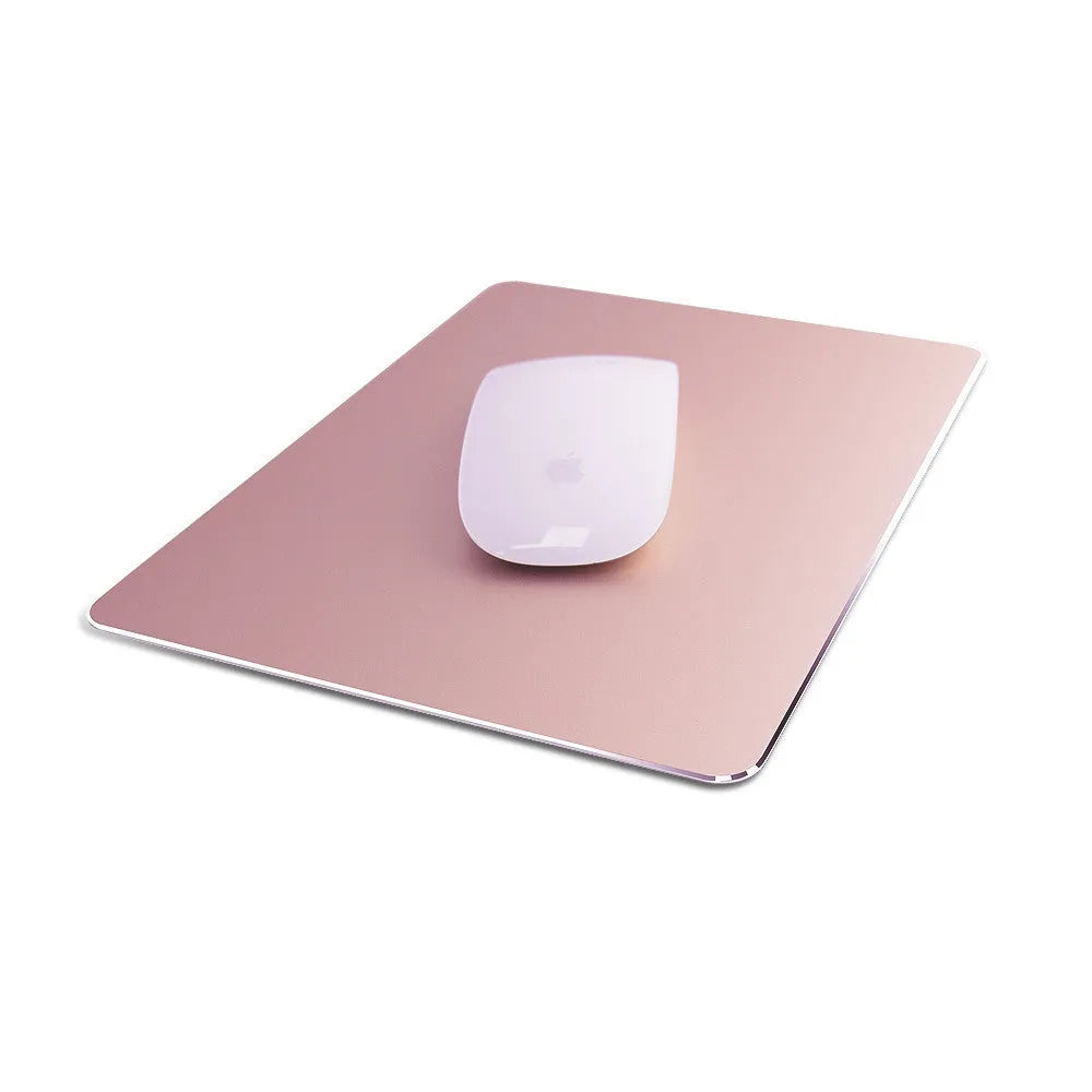 Double-sided aluminium mouse pad in Black on a desk, showing non-slip metal surface and compact size