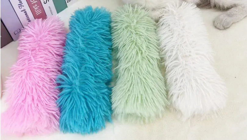 Soft plush cat toy pillow in four colours measuring 27cm by 10cm