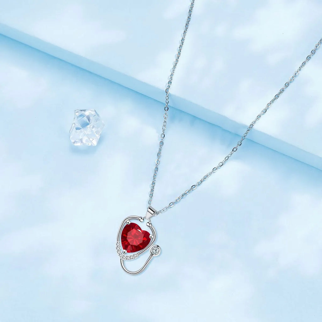Women's copper necklace with red diamond electroplated wings cross stethoscope pendant, casual medical-inspired jewellery