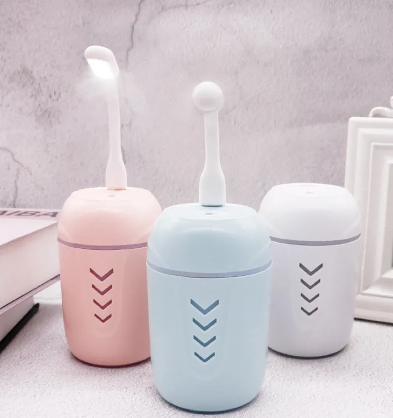 X3 portable car humidifier with columnar shape in blue, pink, or white colours showing USB port