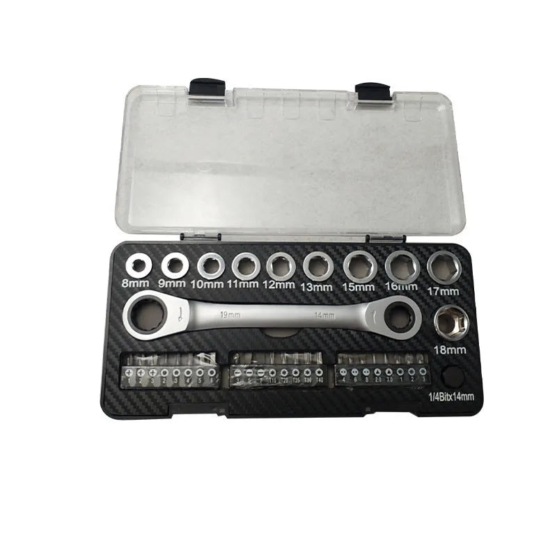 Two-way ratchet wrench with a 1/2 inch drive, surrounded by ten sockets and three batch heads on a workbench.