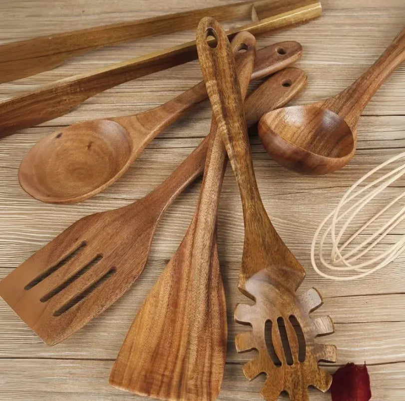 Set of seven wooden cooking utensils with spoon and shovel shapes for use with non-stick pans.