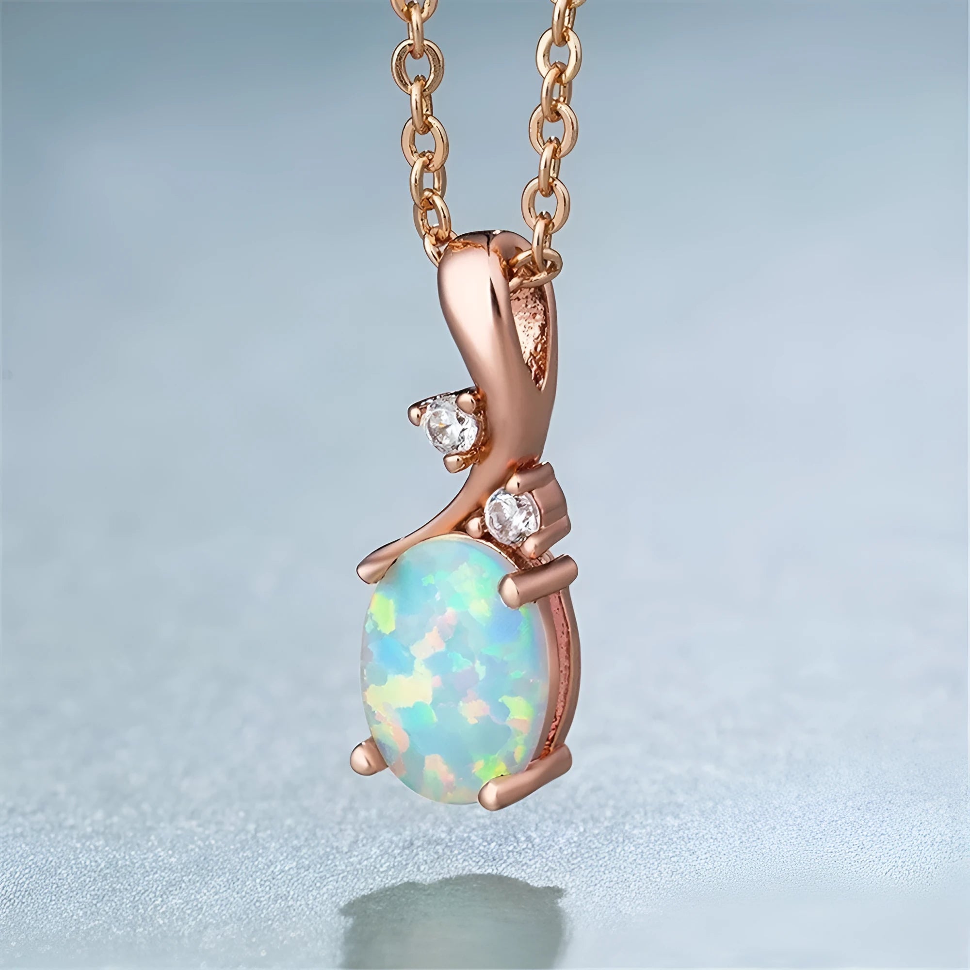 Water drop shaped opal pendant necklace on adjustable O-shaped chain in rose gold or white plating
