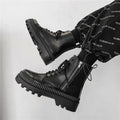Men's black zip-up Dr Martens platform boots with frosted cowhide leather upper and high-top design.